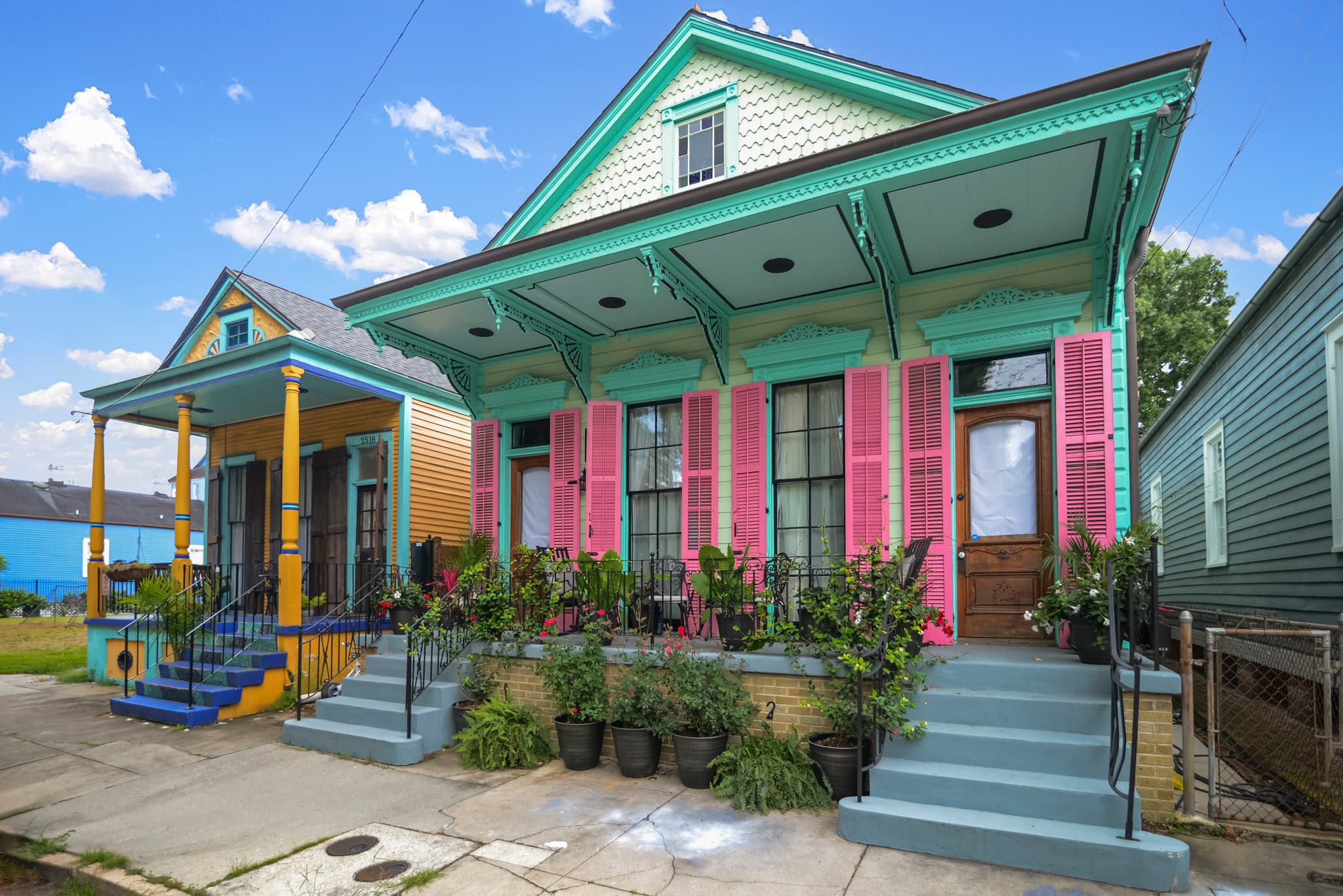 Colorful New Orleans homes with traditional shutters and porches